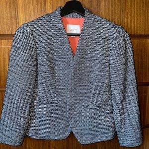 Classic black and white tweed-style blazer.